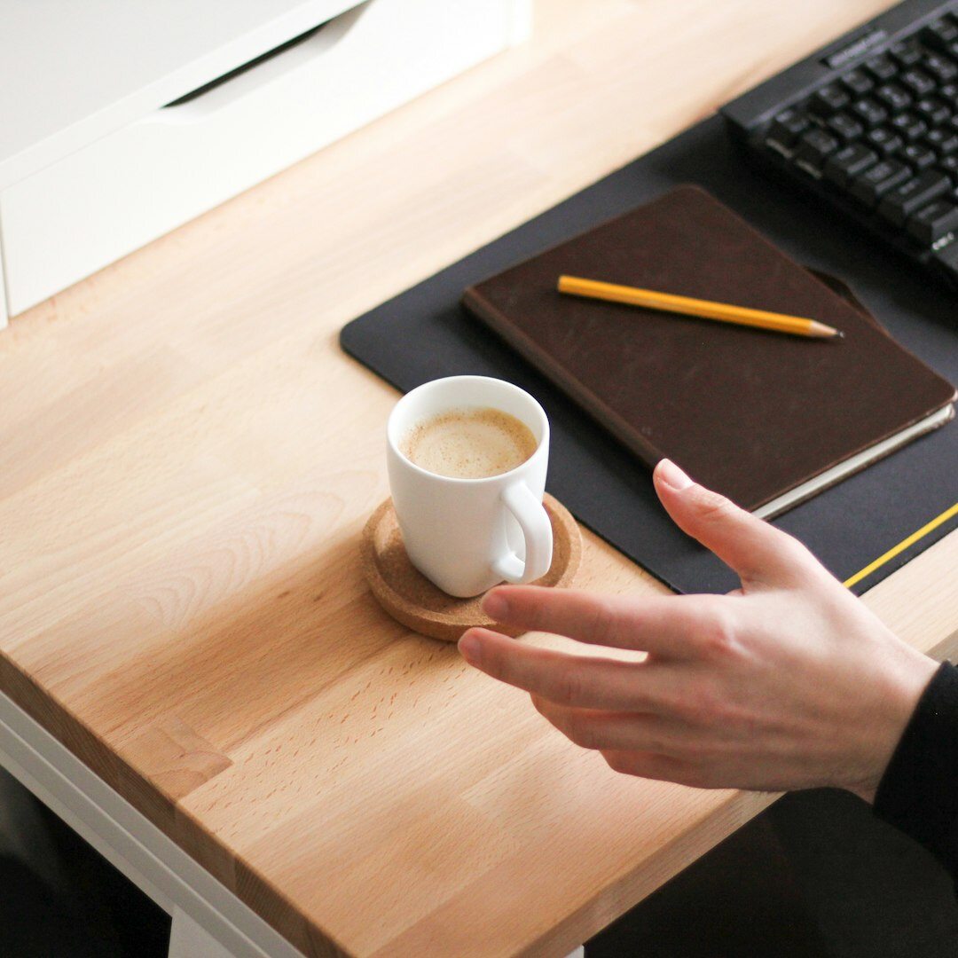 Handshake between advisor and client over a desk