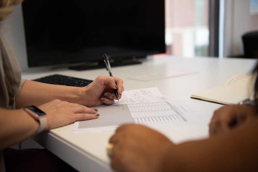Close up of hands signing a legal document